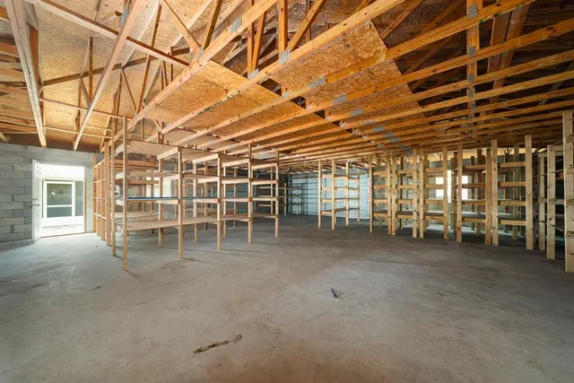 a view of a big room with wooden walls