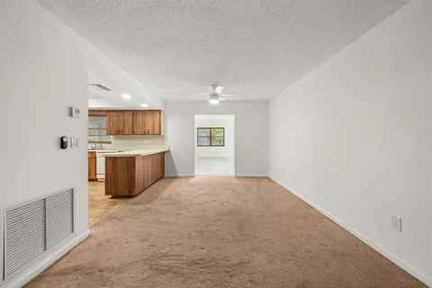 a view of a kitchen with a sink cabinets and a window