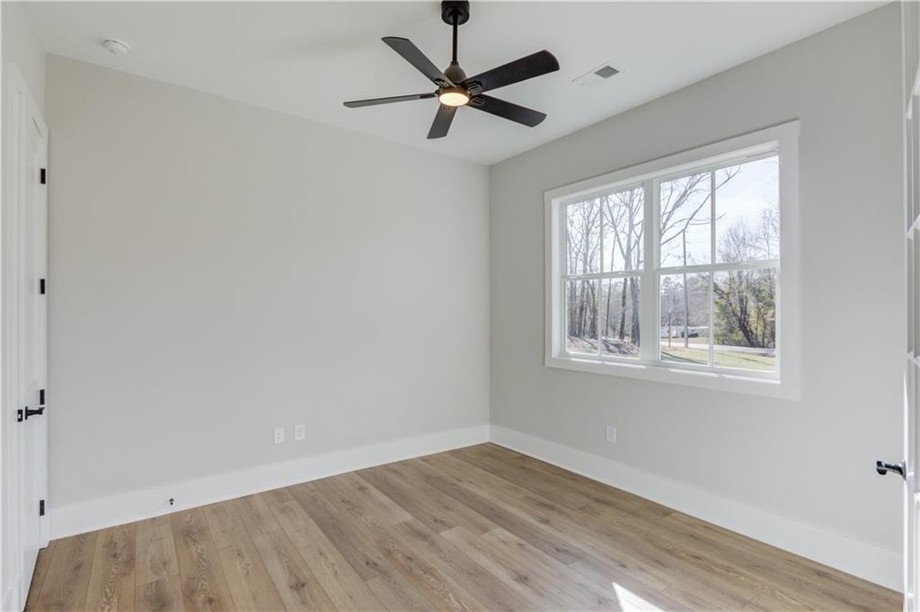 30 River Overlook Way Jefferson, GA 30549 - Photo 11 of 66 wooden floor in an empty room with a window