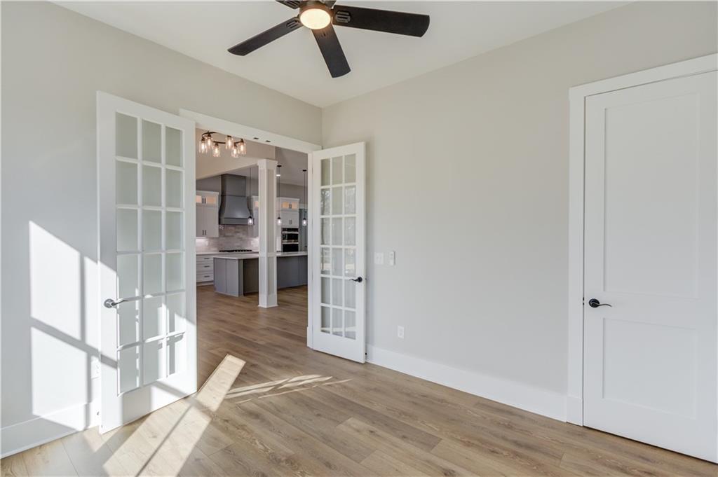 30 River Overlook Way Jefferson, GA 30549 - Photo 12 of 66 an empty room with wooden floor and windows