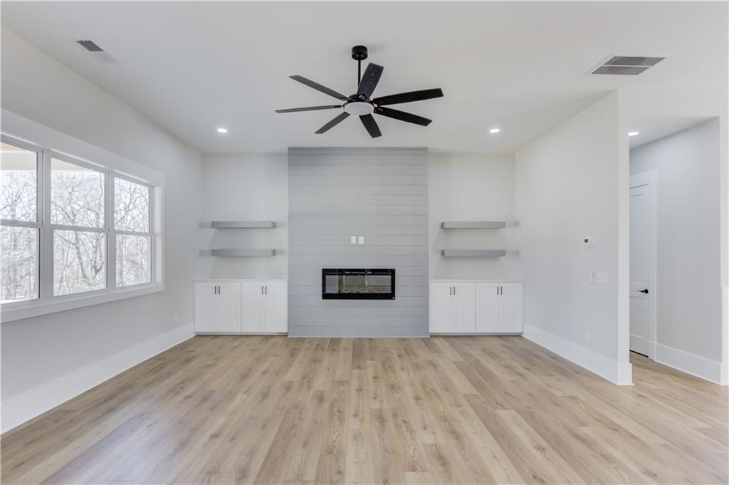 30 River Overlook Way Jefferson, GA 30549 - Photo 17 of 66 a view of empty room with wooden floor and fan