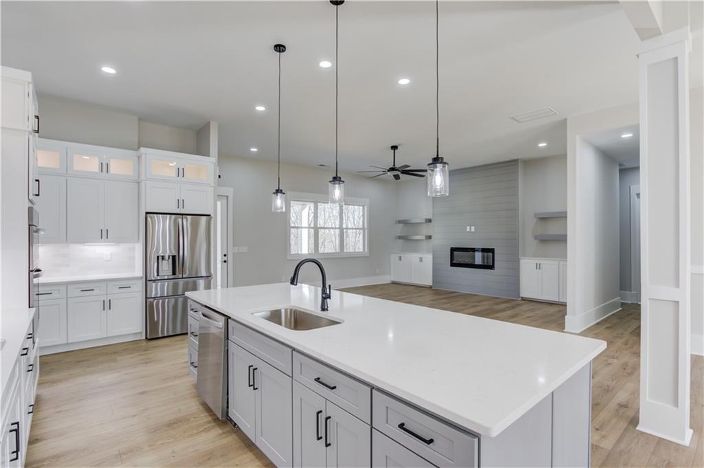 30 River Overlook Way Jefferson, GA 30549 - Photo 26 of 66 a kitchen with kitchen island a sink stainless steel appliances and cabinets