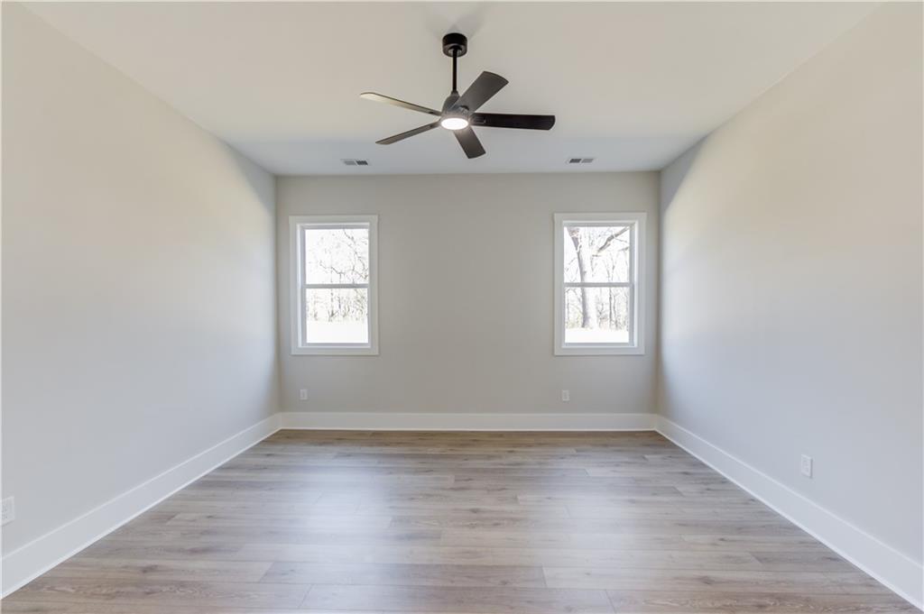 30 River Overlook Way Jefferson, GA 30549 - Photo 28 of 66 wooden floor in an empty room with a window
