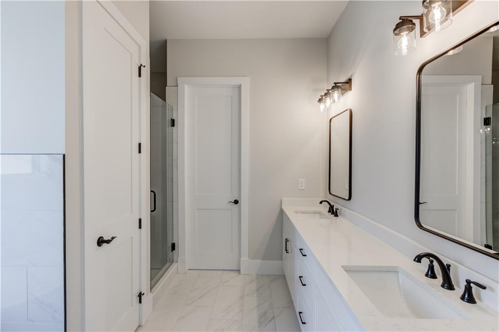 30 River Overlook Way Jefferson, GA 30549 - Photo 30 of 66 a bathroom with a double vanity sink and a tub