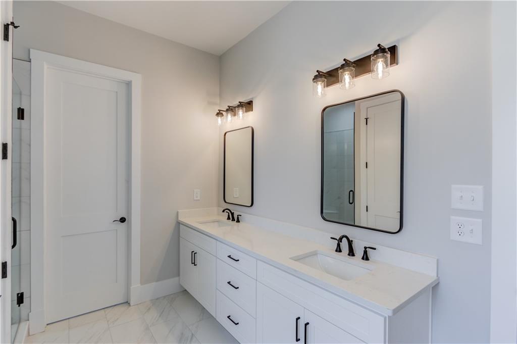 30 River Overlook Way Jefferson, GA 30549 - Photo 31 of 66 a bathroom with double vanity sinks and a mirror