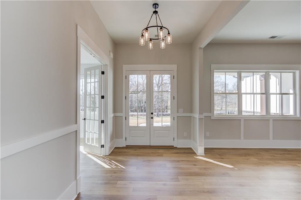 30 River Overlook Way Jefferson, GA 30549 - Photo 10 of 66 a view of empty room with wooden floor and fan