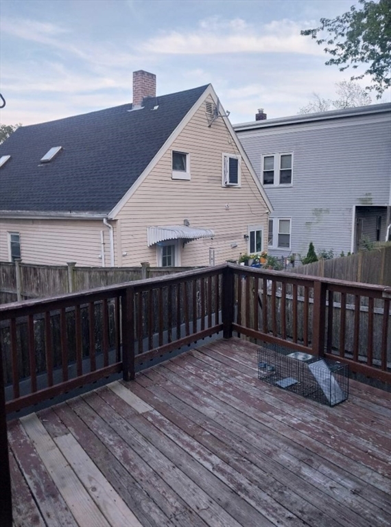 1656 North Shore Road, Unit 1 Revere, MA 02151 - Photo 13 of 18 a view of a house with wooden deck