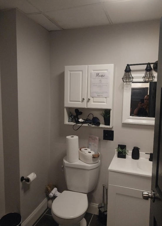 1656 North Shore Road, Unit 1 Revere, MA 02151 - Photo 14 of 18 a bathroom with a toilet a sink and a mirror