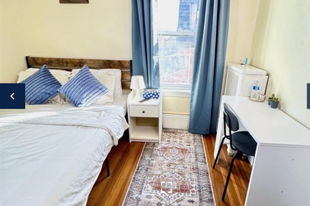 1656 North Shore Road, Unit 1 Revere, MA 02151 - Photo 5 of 18 a bedroom with a bed and a window
