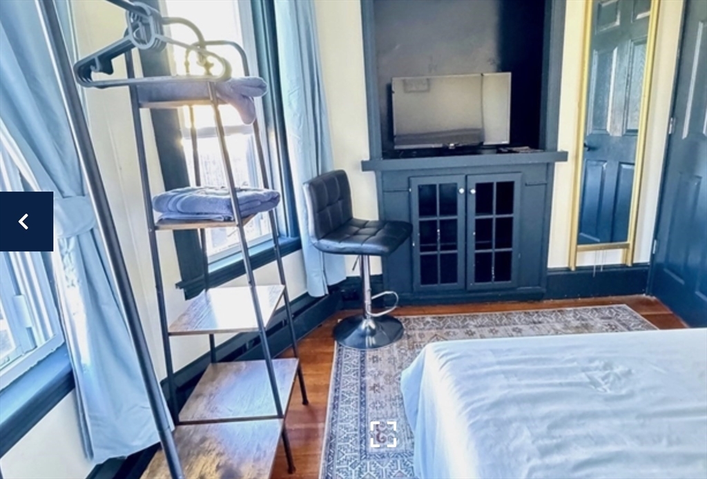1656 North Shore Road, Unit 1 Revere, MA 02151 - Photo 7 of 18 a bedroom with a bed and a window