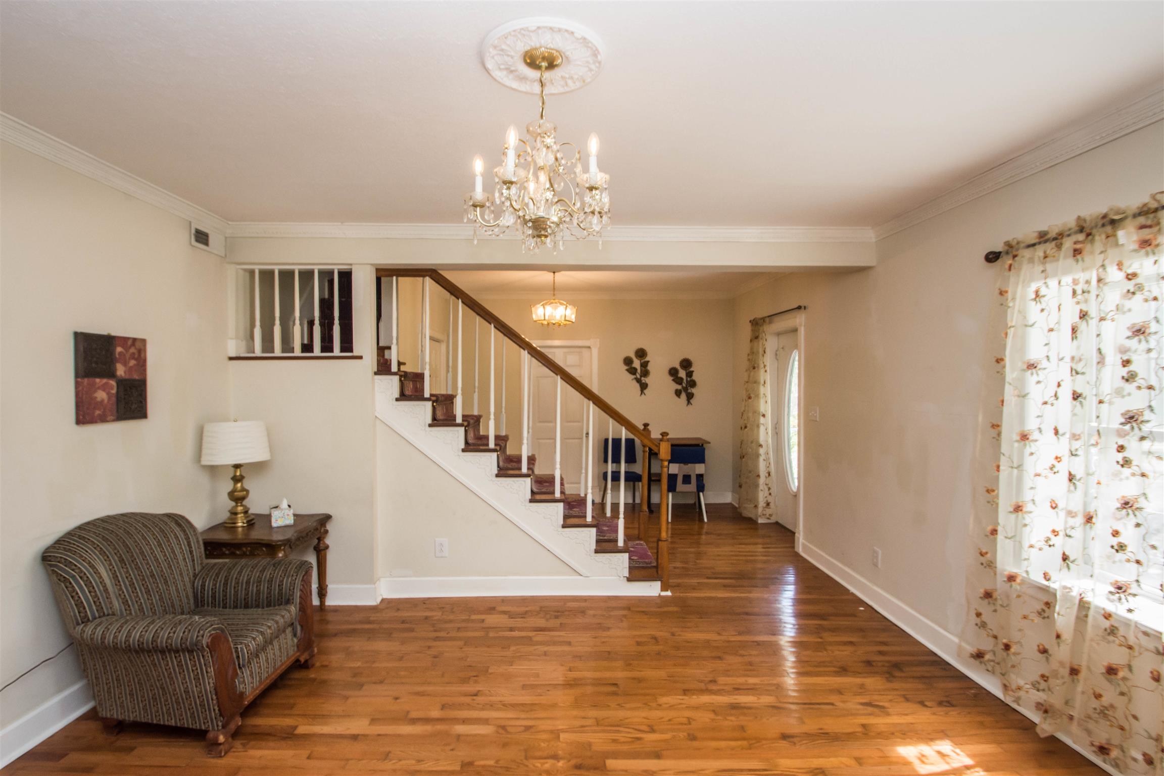1810 Bend Road Clarksville, TN 37040 - Photo 5 of 17 a living room with furniture and a chandelier