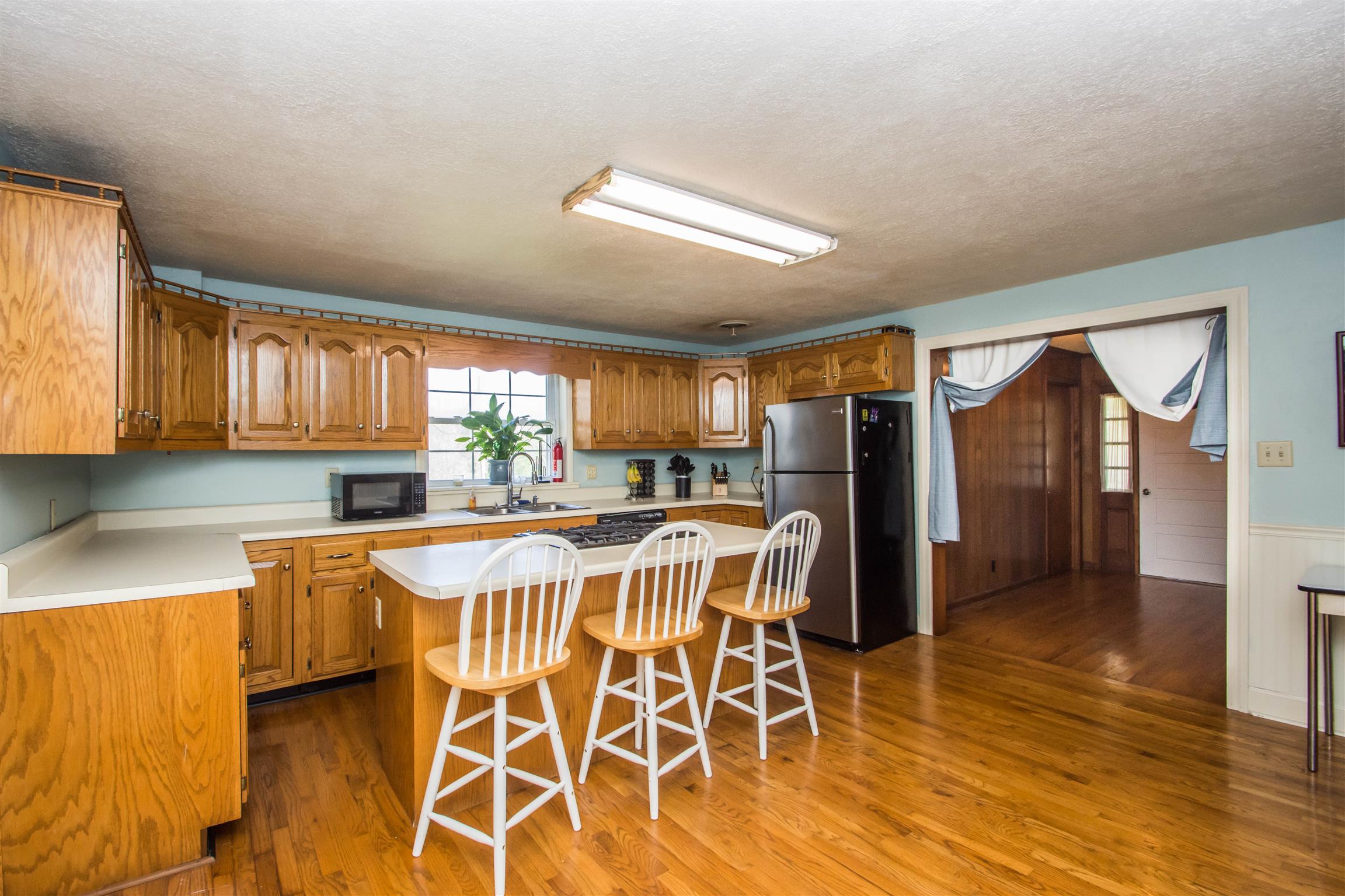 1810 Bend Road Clarksville, TN 37040 - Photo 9 of 17 a view of a dining room with furniture and wooden floor