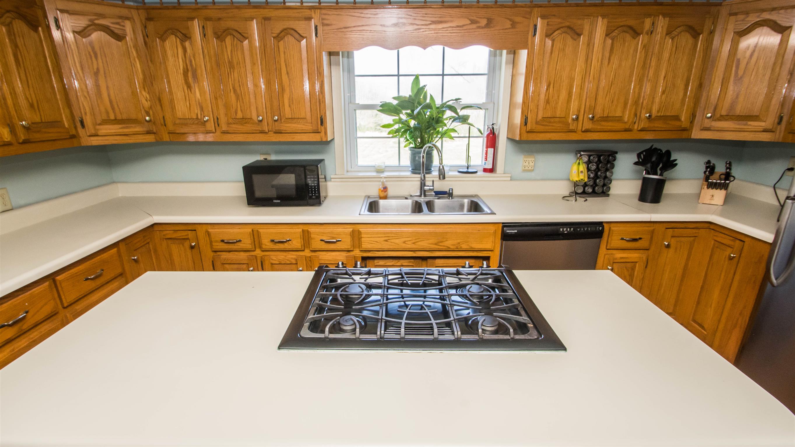 1810 Bend Road Clarksville, TN 37040 - Photo 10 of 17 a kitchen with wooden cabinets and a stove top oven