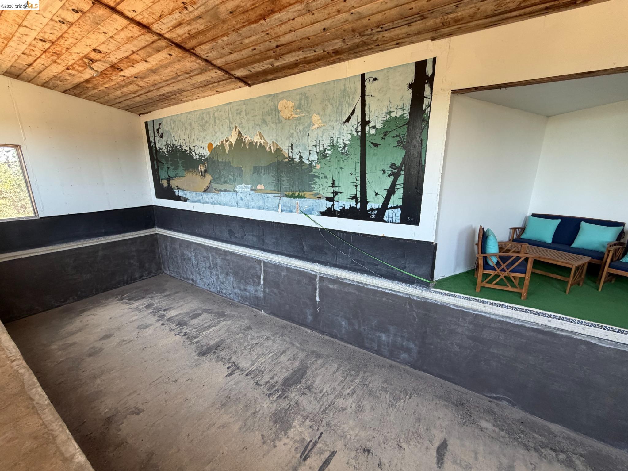 18195 Wards Ferry Road Sonora, CA 95370 - Photo 62 of 67 Open-air room featuring a wood plank ceiling and a painted mural wall