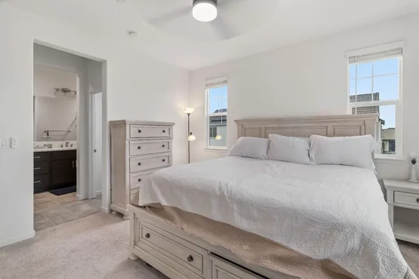 a bathroom with a double vanity sink a mirror and a shower