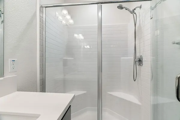 a view of a workspace with a window and lounge chair