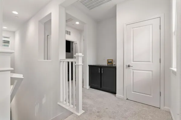 a kitchen with a refrigerator and a stove