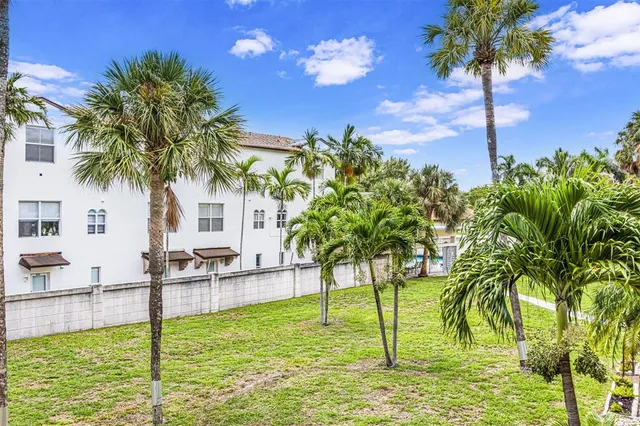 a swimming pool with outdoor seating and yard