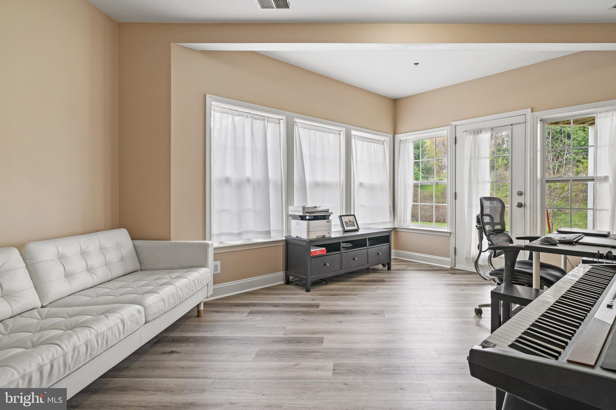 8722 Polished Pebble Way Laurel, MD 20723 - Photo 18 of 58 a living room with furniture and large windows