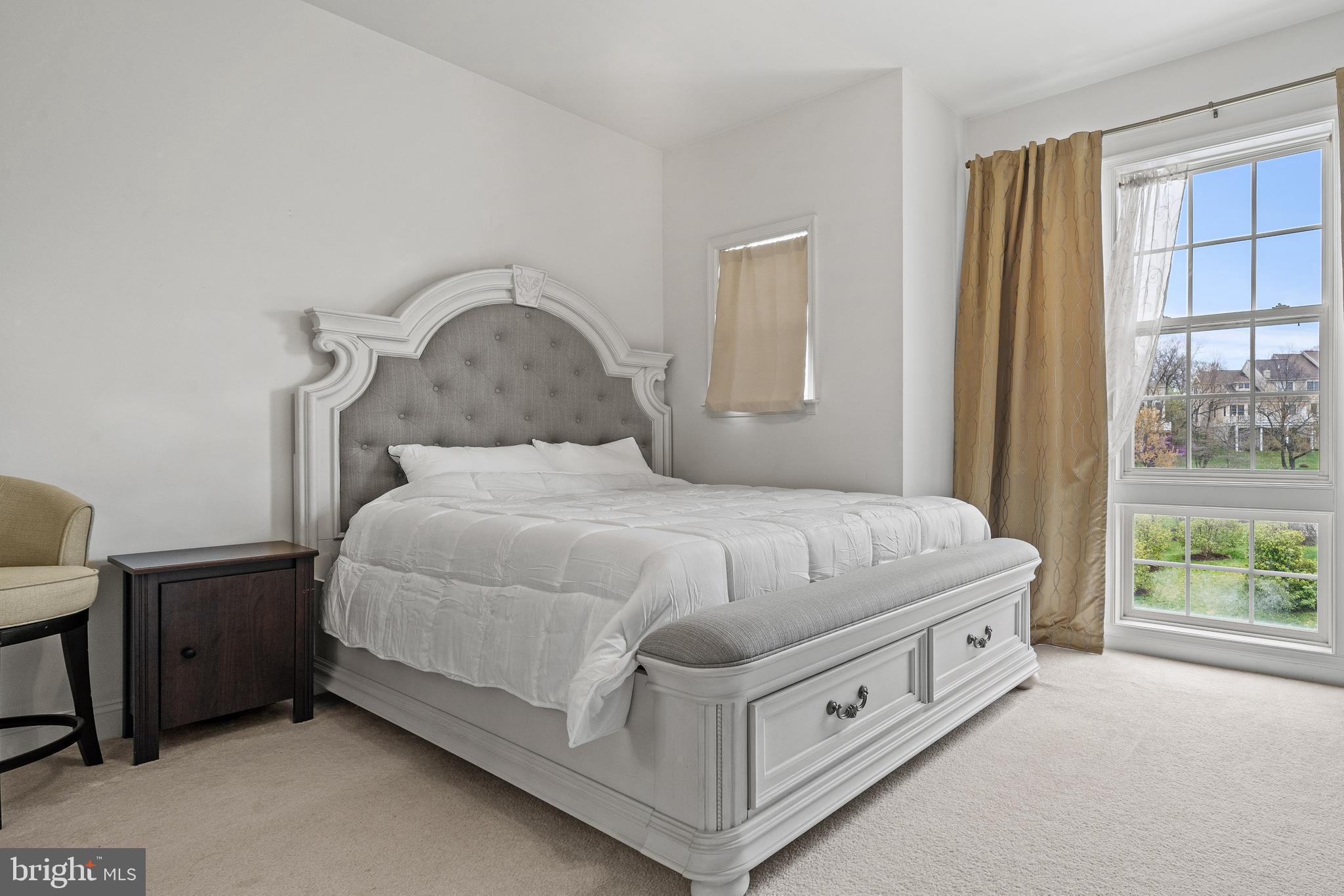 8722 Polished Pebble Way Laurel, MD 20723 - Photo 25 of 58 a spacious bedroom with a bed and a window