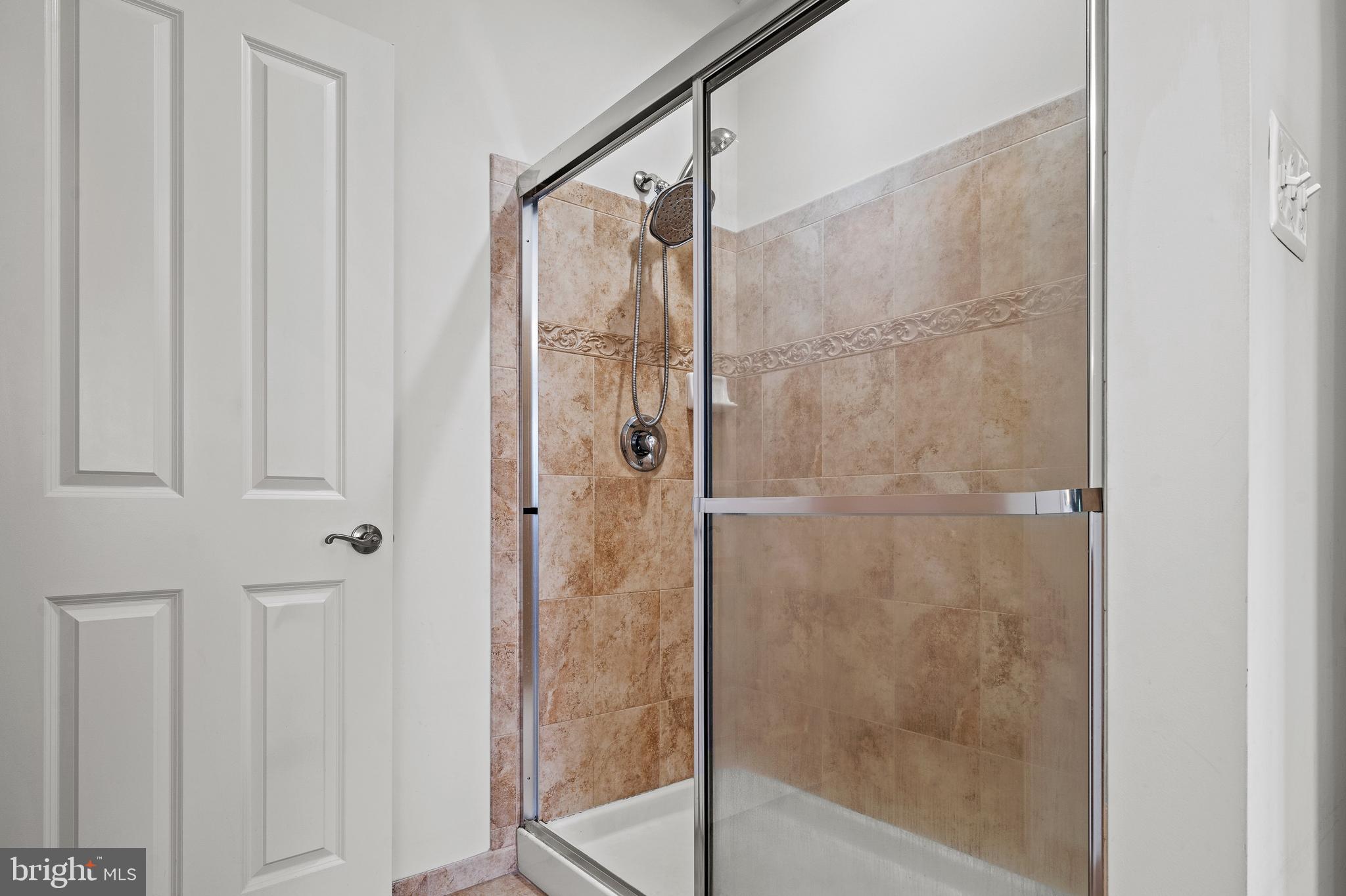 8722 Polished Pebble Way Laurel, MD 20723 - Photo 28 of 58 a bathroom with a shower