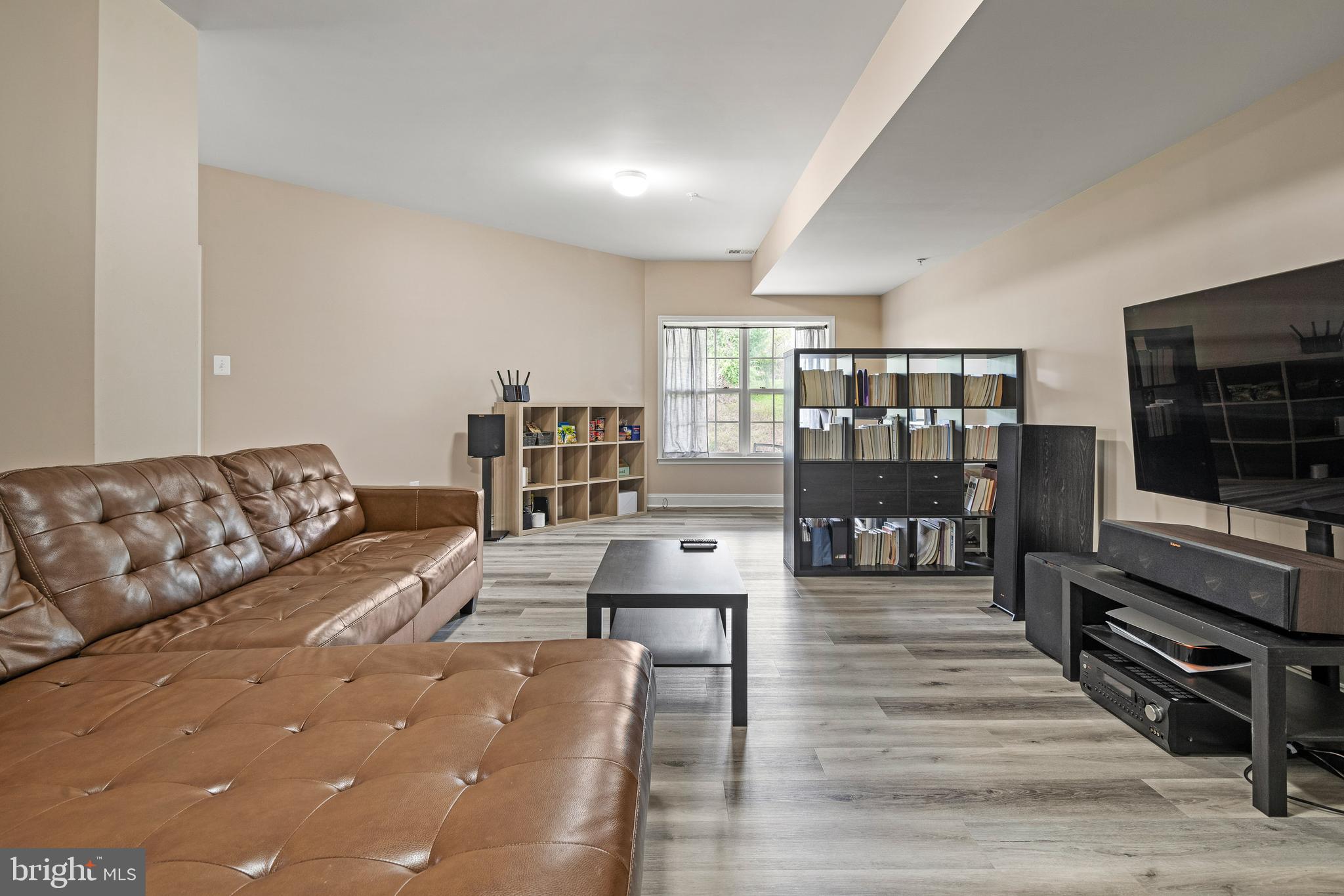 8722 Polished Pebble Way Laurel, MD 20723 - Photo 33 of 58 a living room with furniture and a flat screen tv