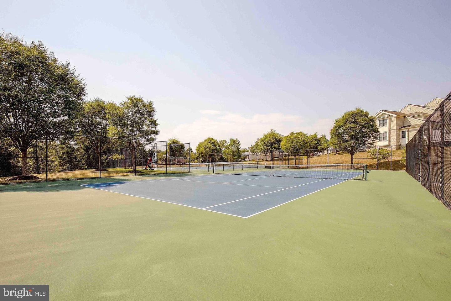 8722 Polished Pebble Way Laurel, MD 20723 - Photo 49 of 58 a view of a tennis court