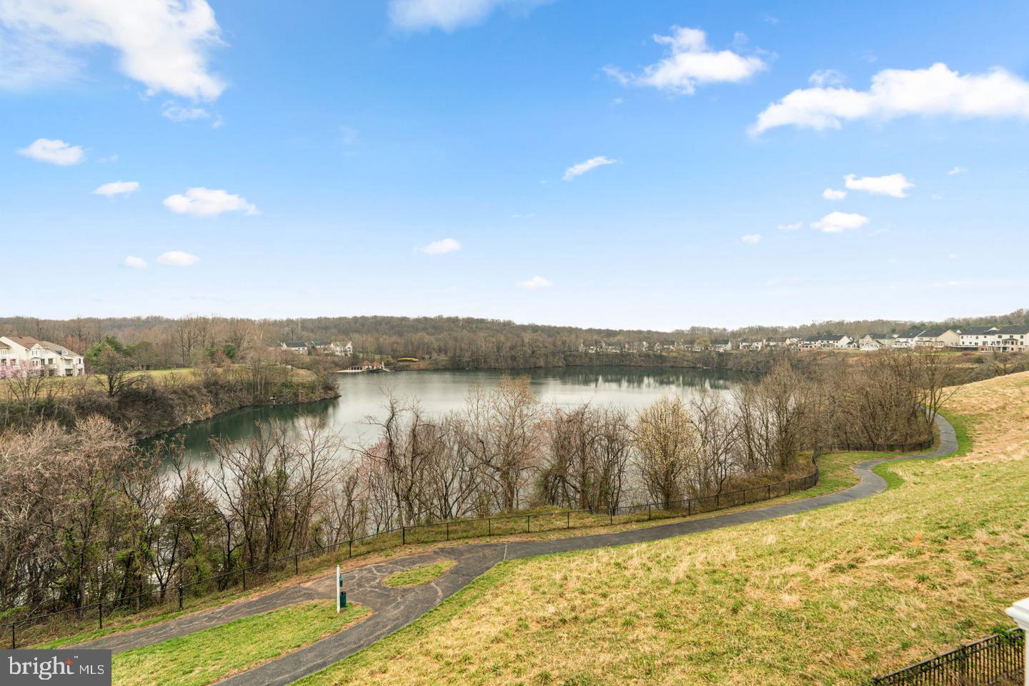 8722 Polished Pebble Way Laurel, MD 20723 - Photo 54 of 58 a view of a lake with a mountain in the background