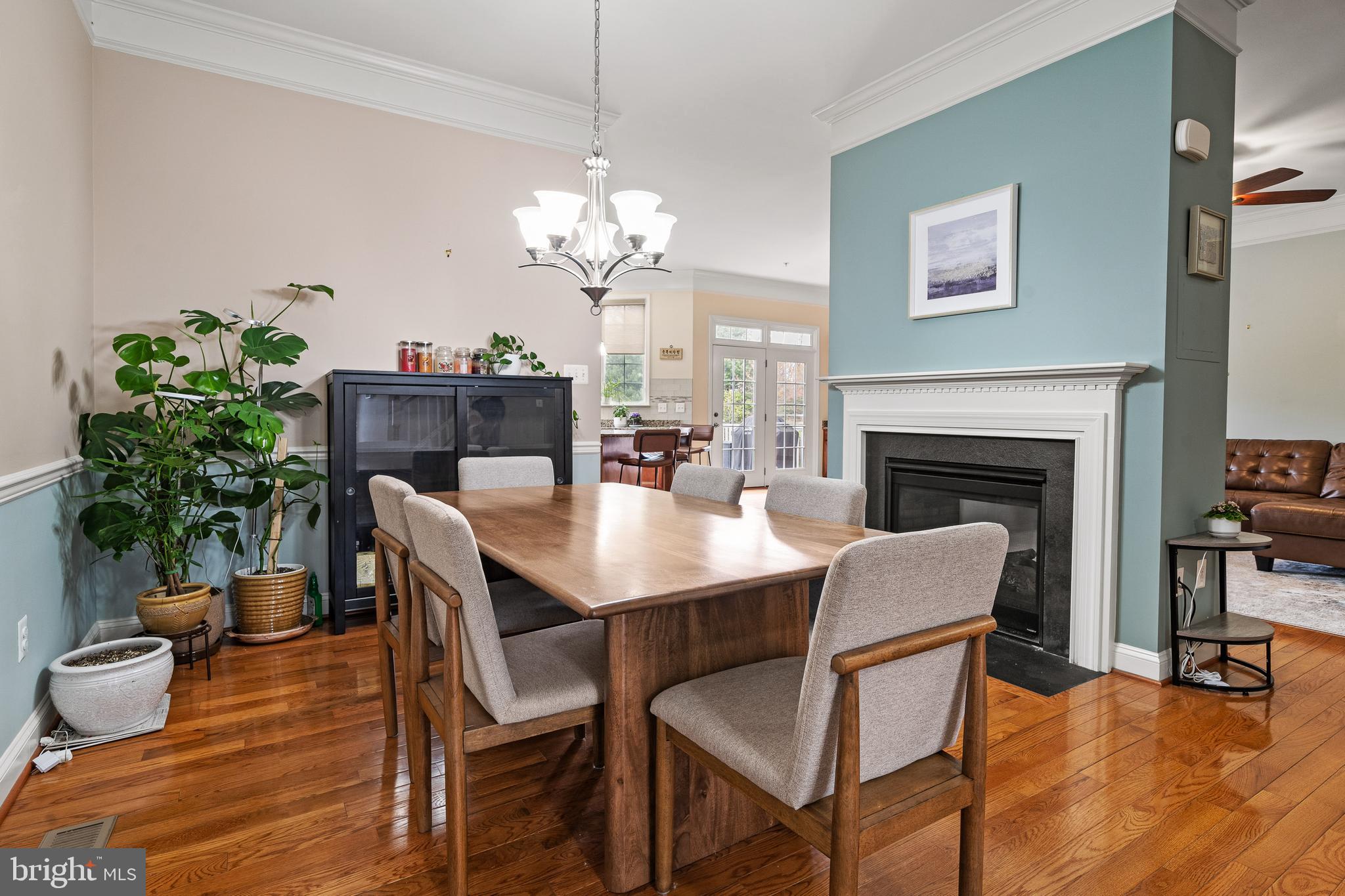8722 Polished Pebble Way Laurel, MD 20723 - Photo 8 of 58 a view of a dining room with furniture wooden floor and chandelier