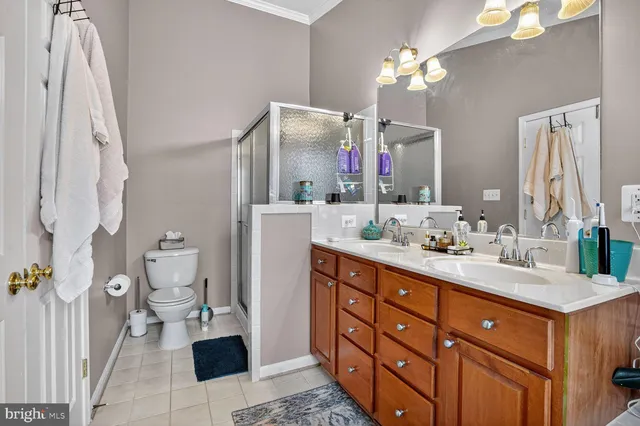 a bathroom with a sink double vanity and a mirror