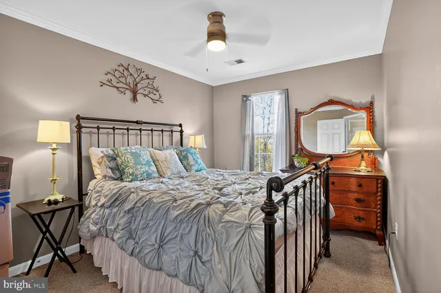 a bedroom with a bed and a mirror