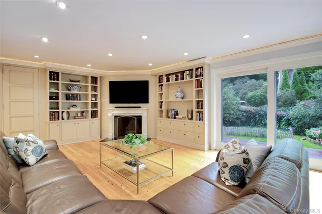 a living room with furniture fireplace and a flat screen tv