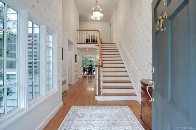a view of entryway with wooden floor and stair