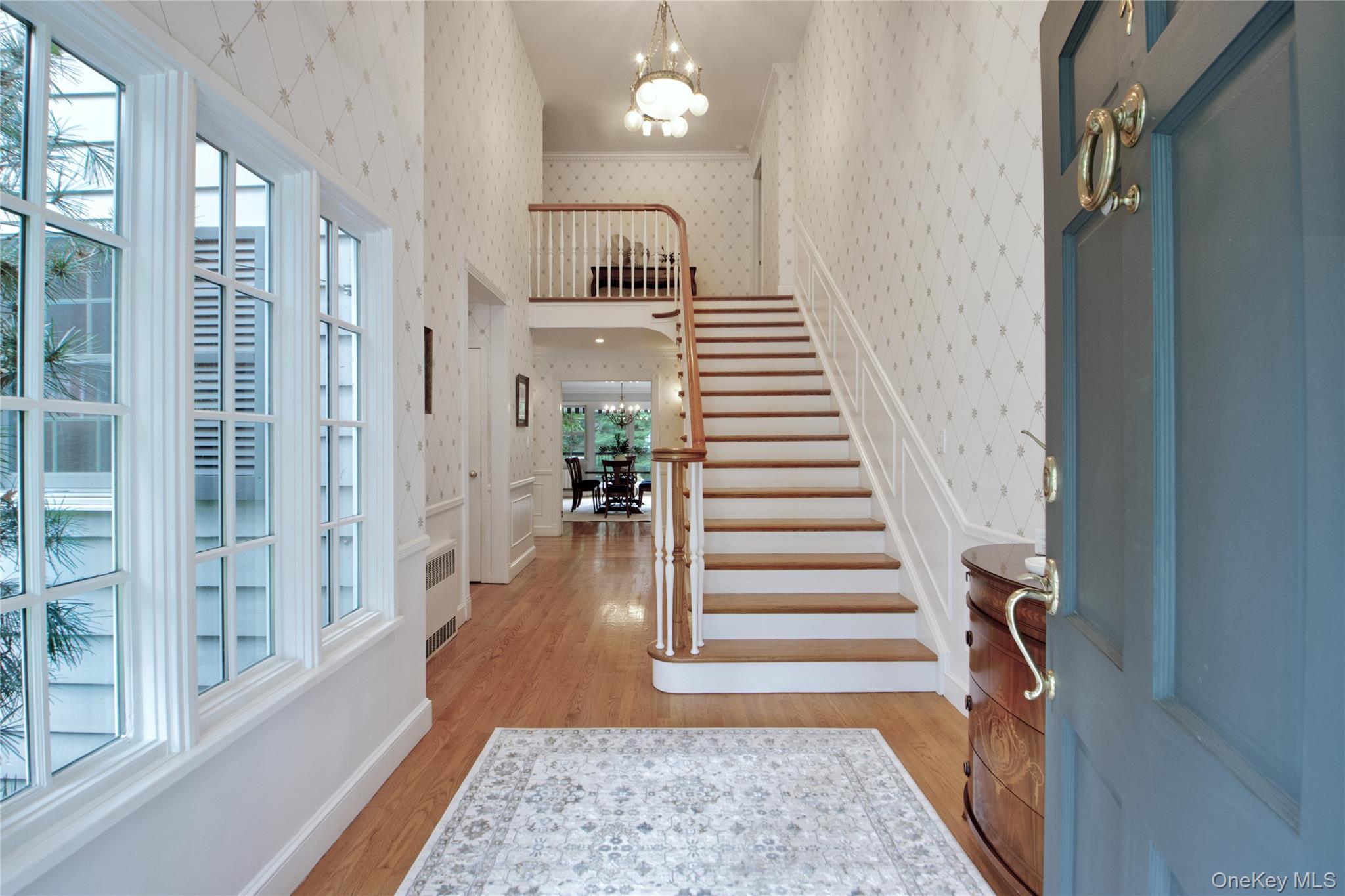 4 Kimson Court Manhasset, NY 11030 - Photo 3 of 30 a view of entryway with wooden floor and stair
