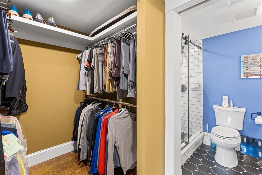1100 Salem Street, Unit 93 Peabody, MA 01960 - Photo 18 of 27 a view of walk in closet with clothes and shoes