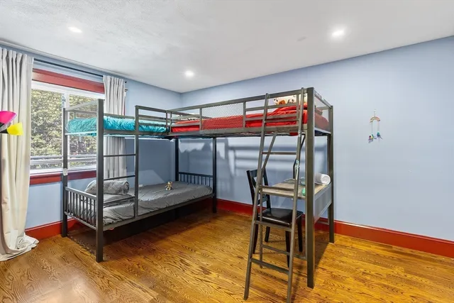 a bedroom with furniture and a window