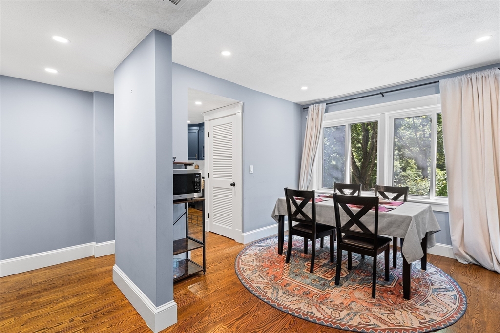 1100 Salem Street, Unit 93 Peabody, MA 01960 - Photo 7 of 27 a view of a dining room with furniture window and wooden floor