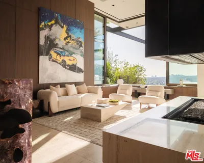 a view of a living room with a large window