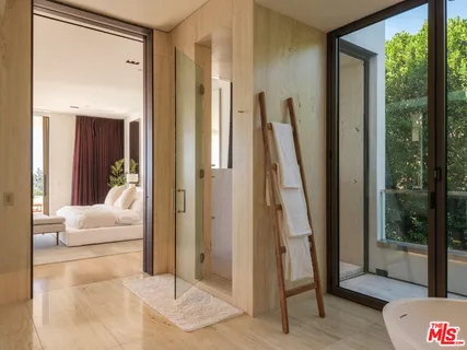 a spacious bathroom with a double vanity sink tub and mirror