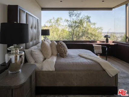 a very nice looking room with a large window and chandelier