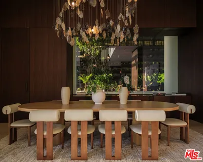 a view of a dining room with furniture and window