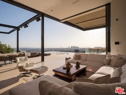 a terrace view with seating space and ocean view