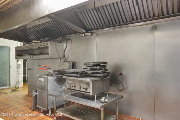 a kitchen with a sink and a stove