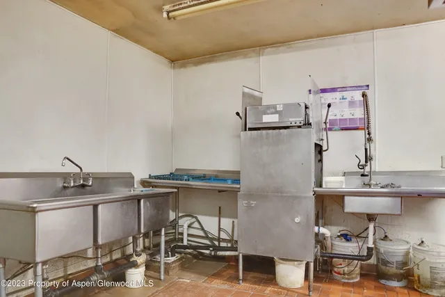 a bathroom with a tub and shower