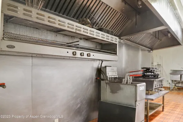 a view of a chairs with table in the patio