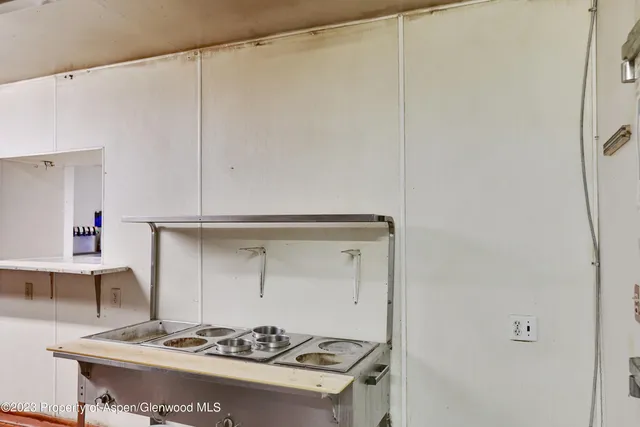 a view of a house with backyard porch and sitting area