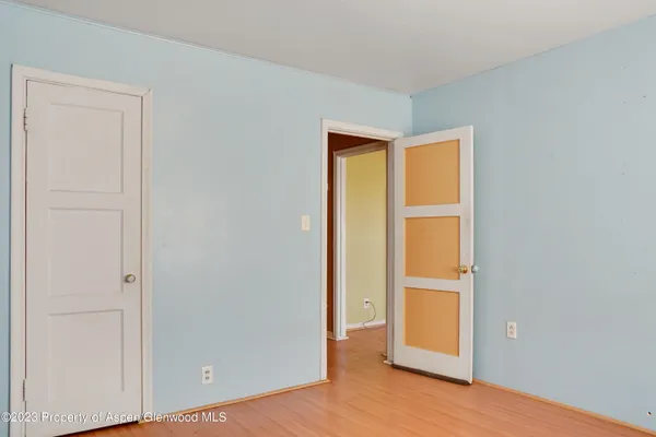 a bathroom with a sink mirror and a shower