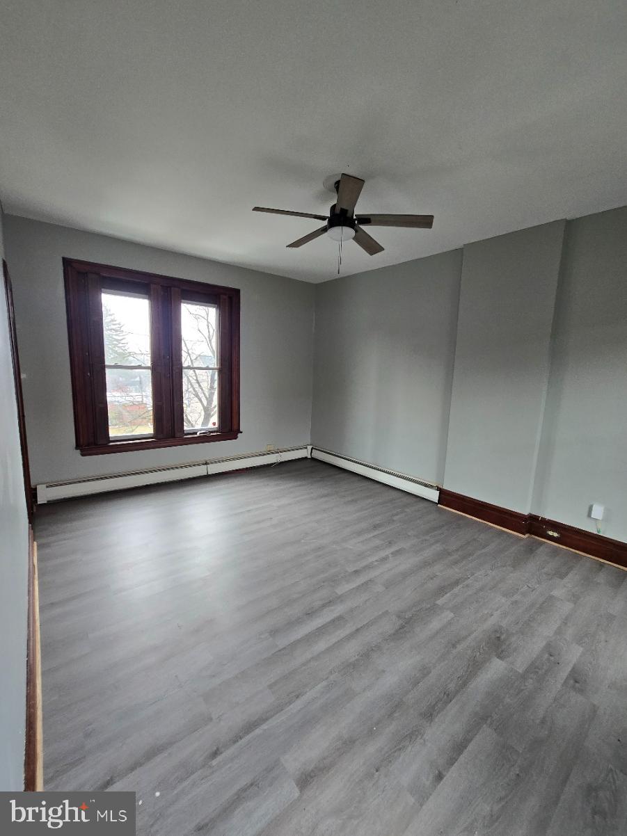 40 South 11th Street Lebanon, PA 17042 - Photo 7 of 11 an empty room with wooden floor and windows