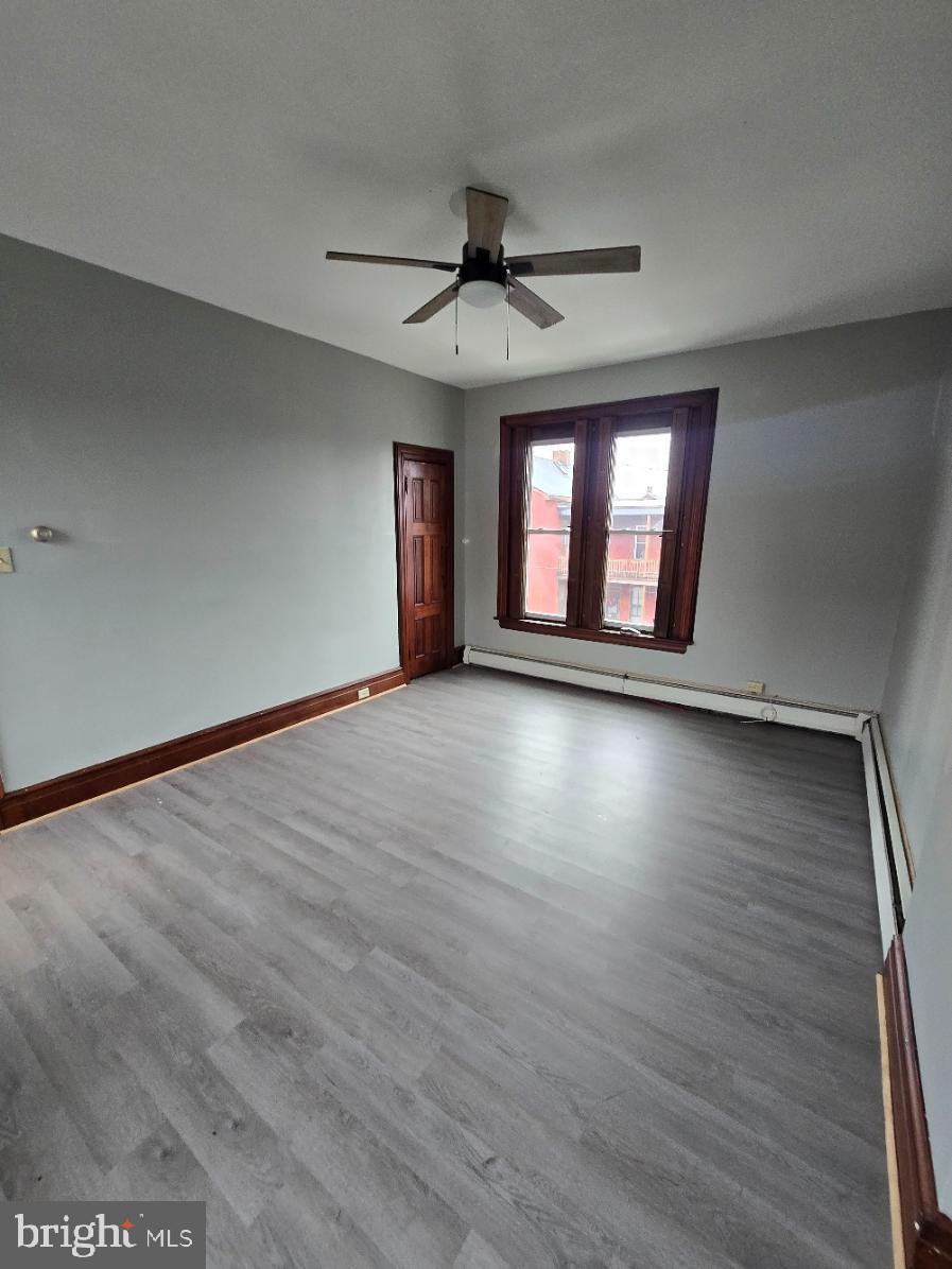 40 South 11th Street Lebanon, PA 17042 - Photo 8 of 11 wooden floor in an empty room with a window