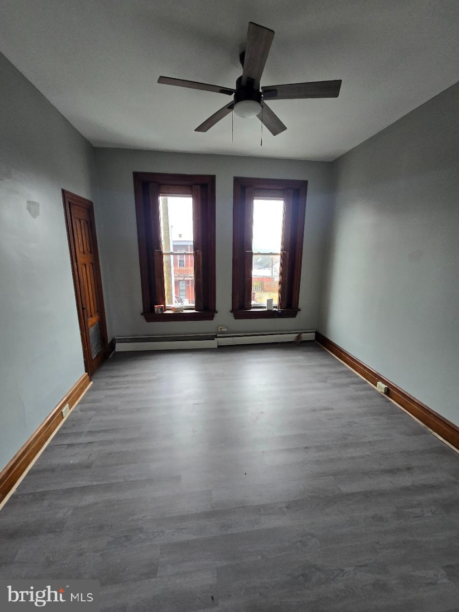 40 South 11th Street Lebanon, PA 17042 - Photo 10 of 11 an empty room with wooden floor and windows